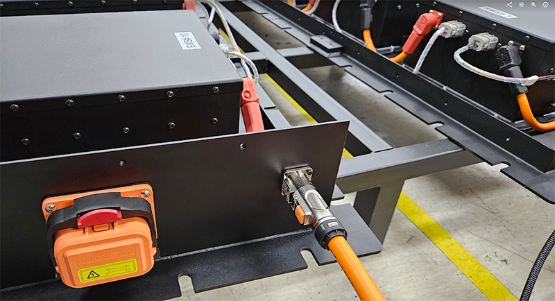 Electric vehicle battery pack with charging cable connected